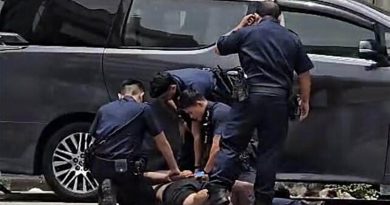 壮硕男神情恍惚躺路面 拒捕袭警 竟是通缉犯